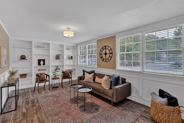 living room featuring dark hardwood / wood-style flooring and built in features