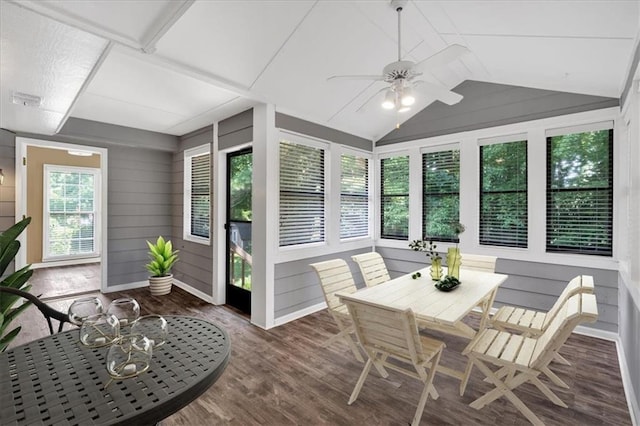 sunroom / solarium with ceiling fan and vaulted ceiling