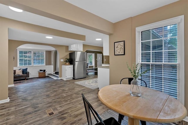 dining space featuring dark wood-type flooring