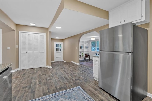 kitchen featuring white cabinetry, dark wood-type flooring, and appliances with stainless steel finishes