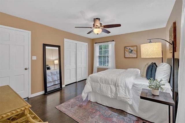 bedroom with dark hardwood / wood-style flooring, ceiling fan, and a closet