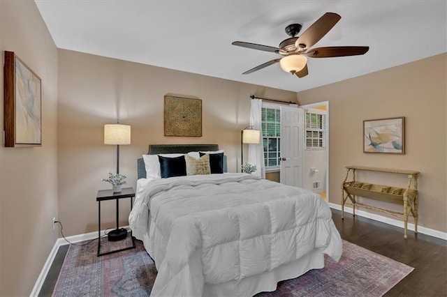 bedroom featuring ceiling fan and dark wood-type flooring