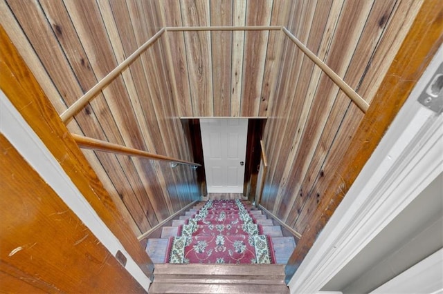 staircase with wooden walls