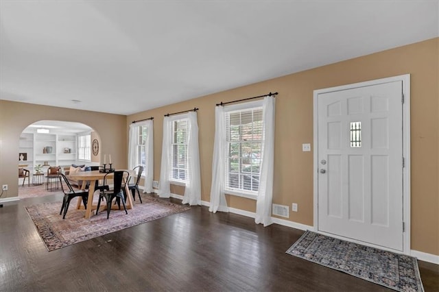 entrance foyer featuring dark hardwood / wood-style floors