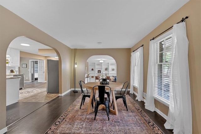 dining area with dark wood-type flooring