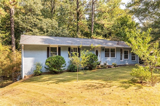 ranch-style home with a front lawn