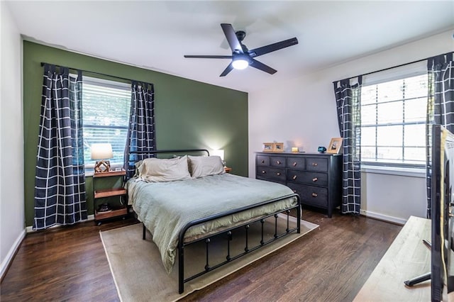 bedroom featuring dark hardwood / wood-style flooring and ceiling fan