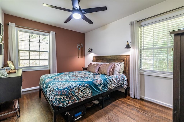 bedroom featuring ceiling fan and dark wood-type flooring