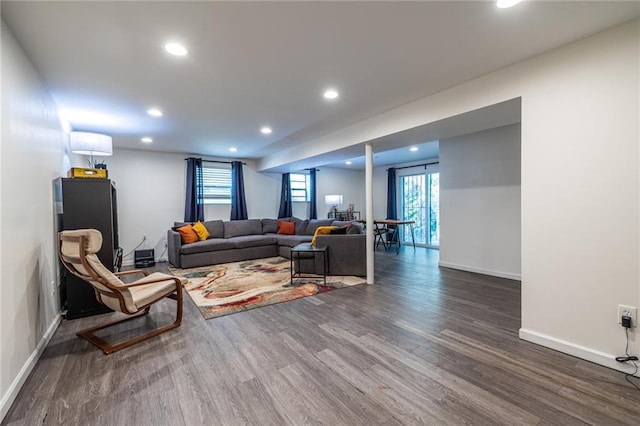 living room with dark hardwood / wood-style floors