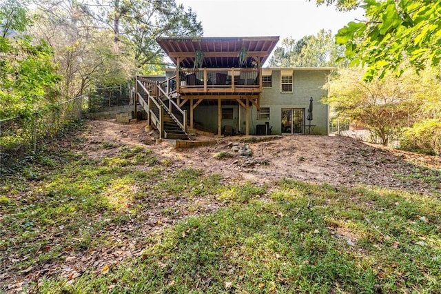 rear view of property with a deck and central AC unit