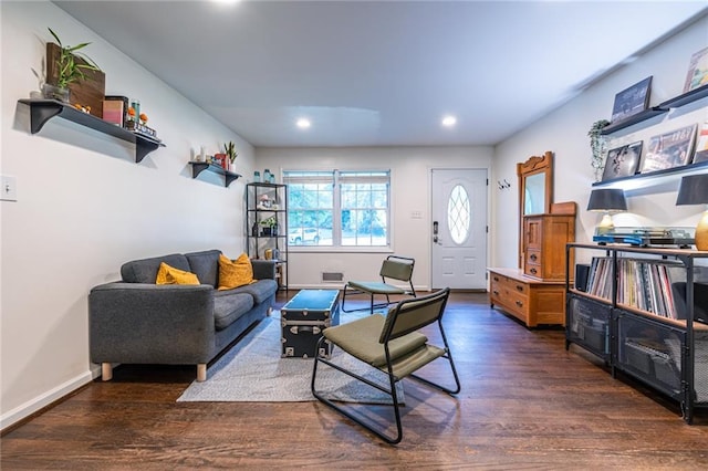 living room with dark hardwood / wood-style flooring