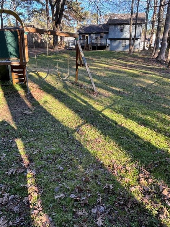 view of yard with a carport and a playground