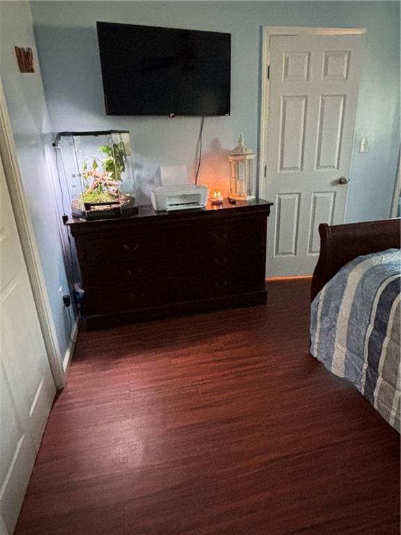 bedroom featuring dark wood-style floors