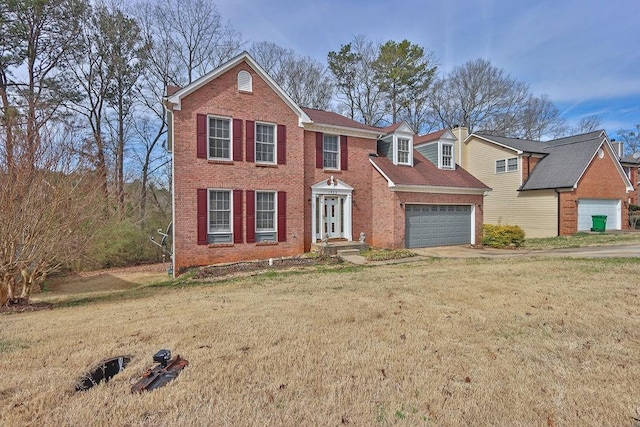 view of front facade featuring a front yard and a garage