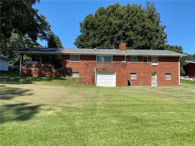 rear view of property with a yard