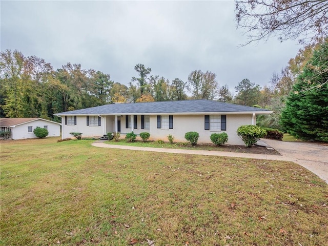 ranch-style house with a front lawn