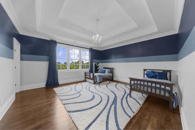 10150 Cedar Ridge Dr, Milton, GA 30004 - bedroom with a tray ceiling, a chandelier, and wood finished floors