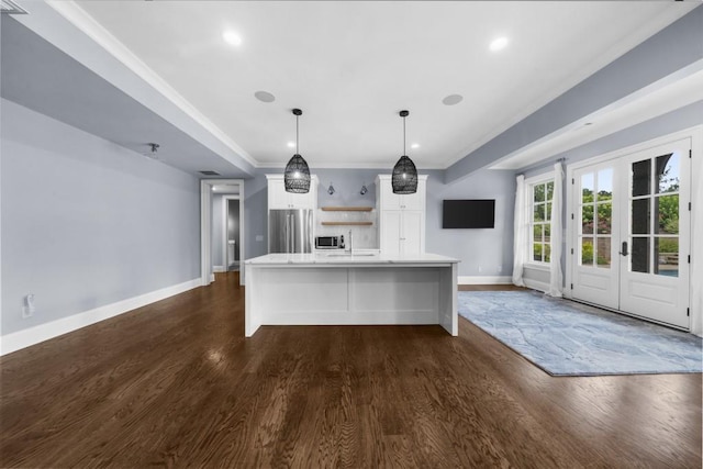 10150 Cedar Ridge Dr, Milton, GA 30004 - kitchen with stainless steel appliances, dark wood-style flooring, light countertops, white cabinets, and a spacious island
