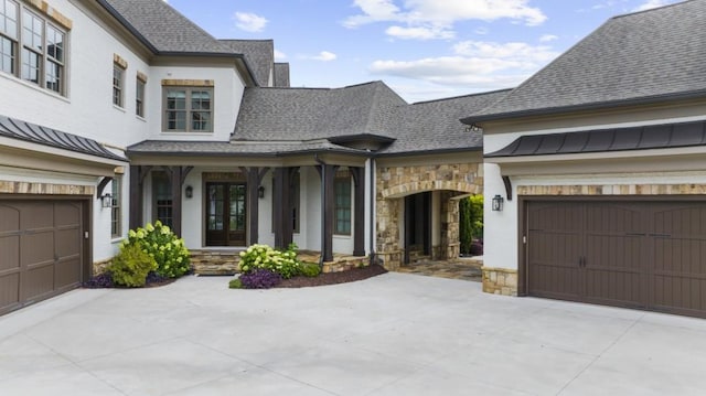 10150 Cedar Ridge Dr, Milton, GA 30004 - view of front facade with stone siding, a garage, and concrete driveway