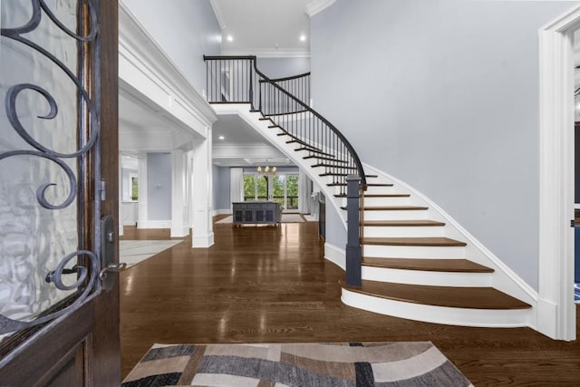 10150 Cedar Ridge Dr, Milton, GA 30004 - entryway with ornamental molding, stairway, wood finished floors, a towering ceiling, and ornate columns