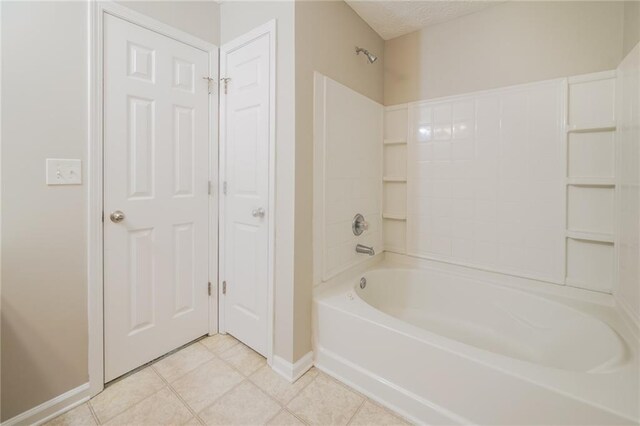 full bathroom featuring baseboards, shower / washtub combination, and tile patterned floors