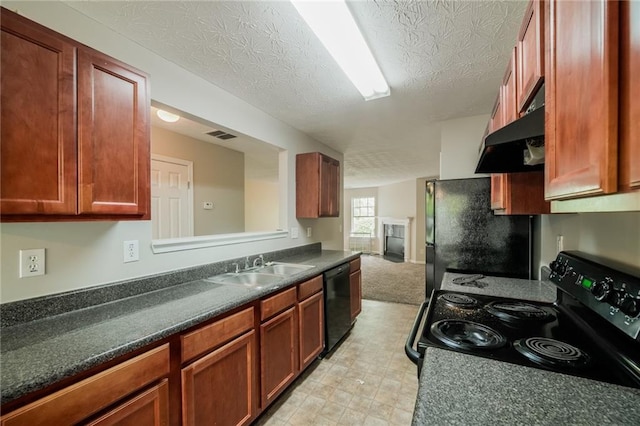 kitchen featuring black appliances, dark countertops, a sink, and under cabinet range hood