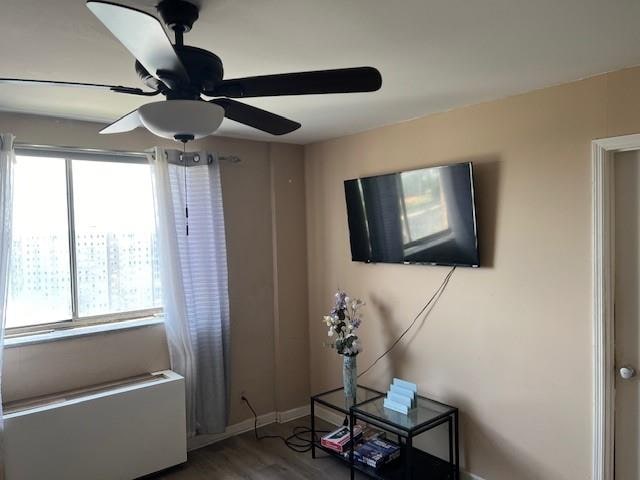 interior space with hardwood / wood-style flooring, a wealth of natural light, and ceiling fan