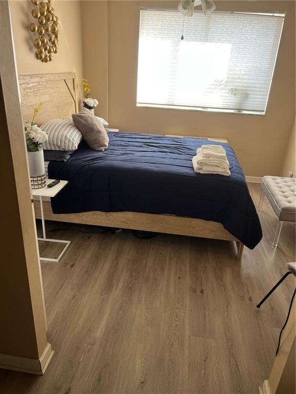 bedroom featuring wood-type flooring