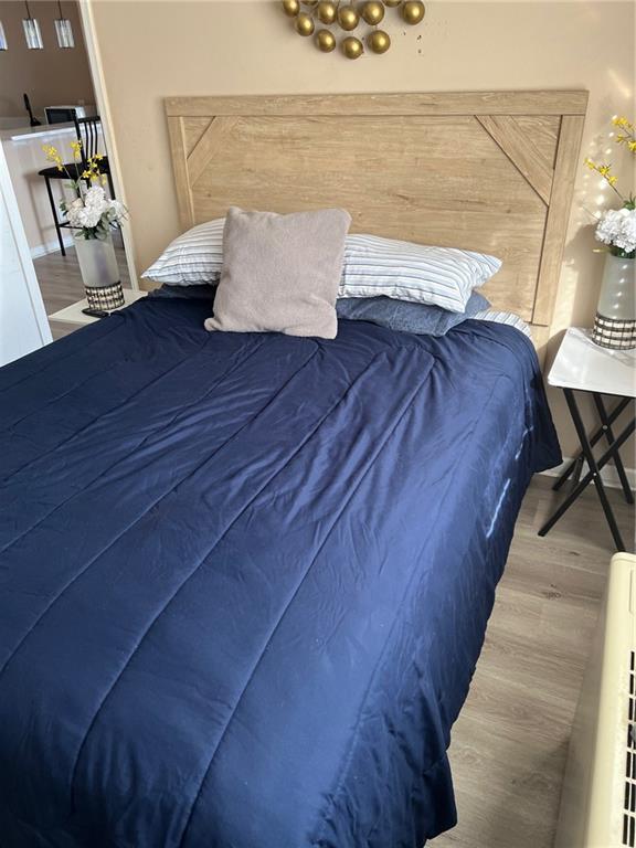 bedroom featuring hardwood / wood-style flooring