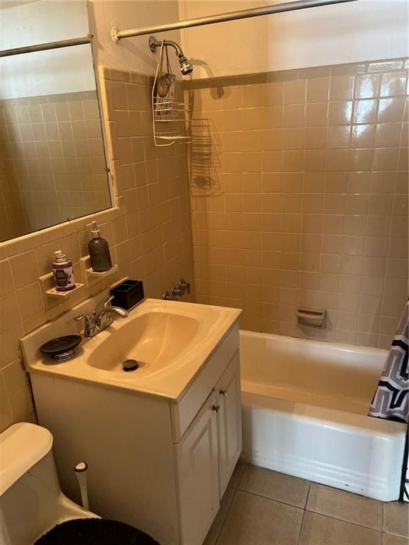 full bathroom featuring shower / tub combo with curtain, toilet, tasteful backsplash, vanity, and tile patterned flooring