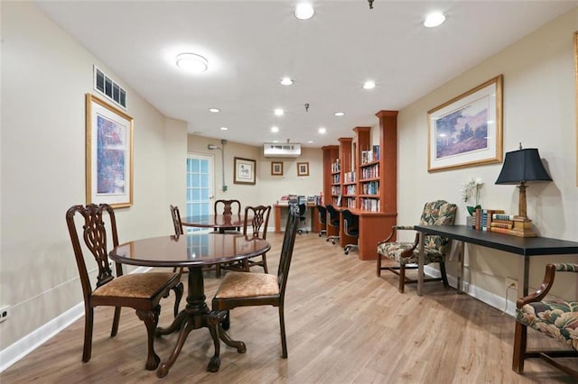 1501 Clairmont Rd Unit 1027, Decatur, GA 30033 - dining room featuring a wall unit AC, recessed lighting, visible vents, baseboards, and light wood finished floors