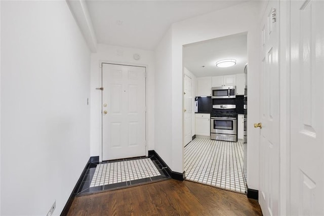 1501 Clairmont Rd Unit 1027, Decatur, GA 30033 - hallway featuring baseboards and wood finished floors