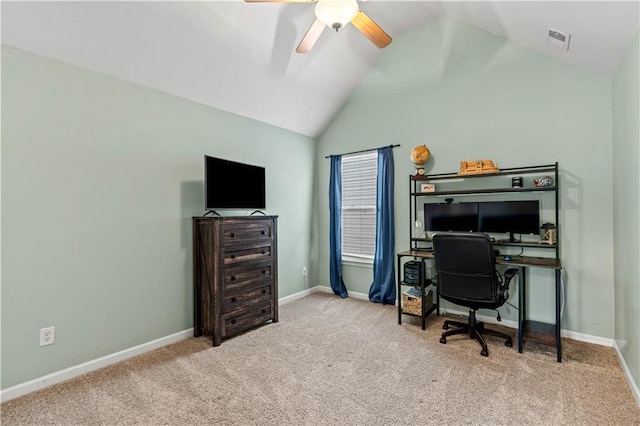carpeted office space featuring lofted ceiling, a ceiling fan, and baseboards
