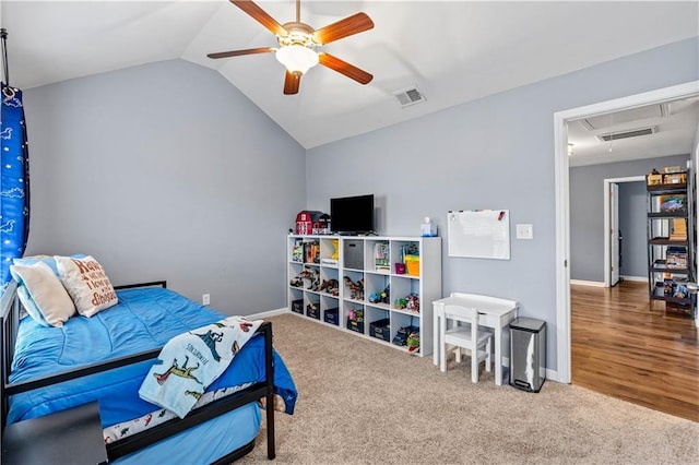 bedroom featuring attic access, lofted ceiling, carpet floors, ceiling fan, and baseboards