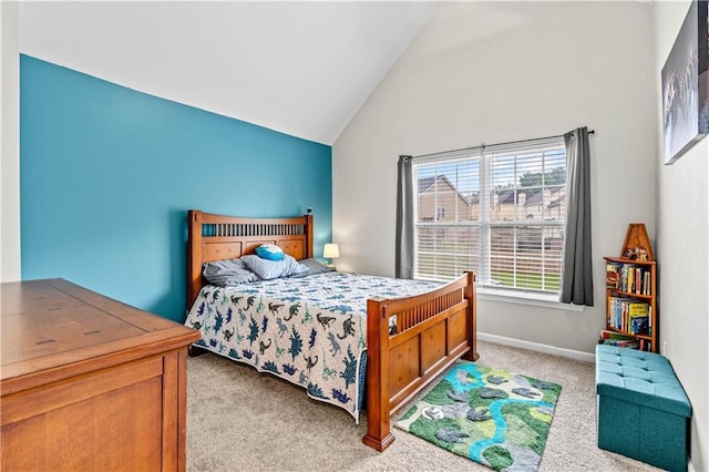 carpeted bedroom featuring high vaulted ceiling and baseboards