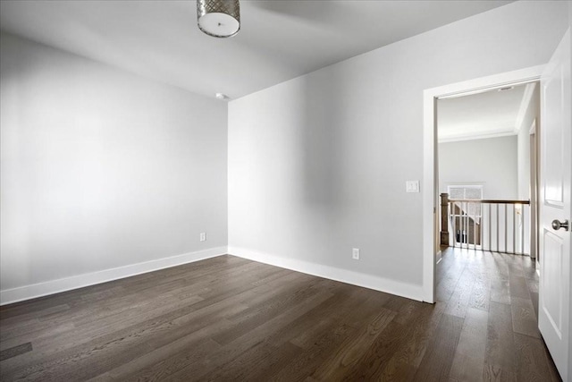 empty room with dark wood-type flooring