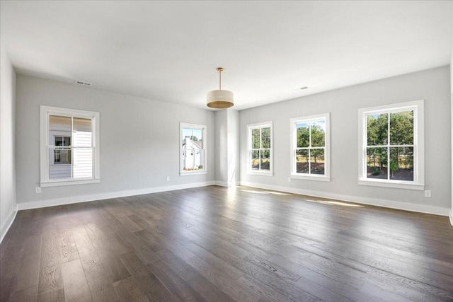 empty room featuring dark hardwood / wood-style floors