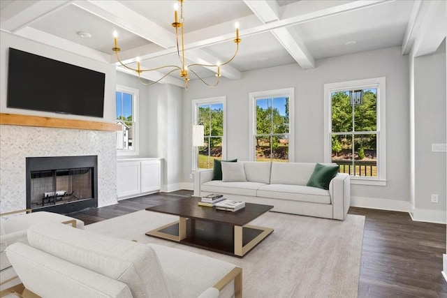 living area featuring dark wood-style flooring, a fireplace, coffered ceiling, and baseboards