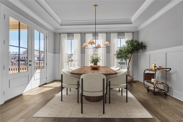 unfurnished dining area with dark hardwood / wood-style flooring, an inviting chandelier, and sink