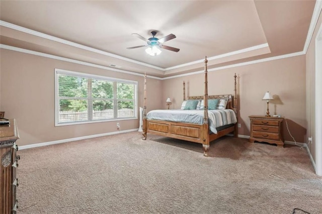 1249 Austin Thomas Dr, Dacula, GA 30019 - carpeted bedroom featuring crown molding, baseboards, a ceiling fan, and a tray ceiling