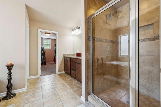 1249 Austin Thomas Dr, Dacula, GA 30019 - bathroom featuring vanity, baseboards, a stall shower, and tile patterned floors