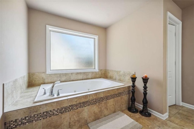 1249 Austin Thomas Dr, Dacula, GA 30019 - bathroom featuring tile patterned flooring and a tub with jets