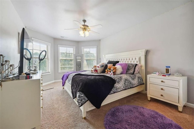 1249 Austin Thomas Dr, Dacula, GA 30019 - carpeted bedroom featuring a ceiling fan, baseboards, and visible vents