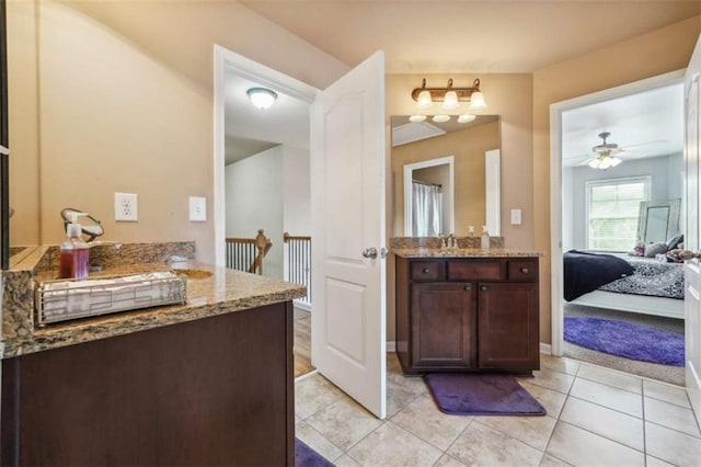 1249 Austin Thomas Dr, Dacula, GA 30019 - full bathroom with vanity, baseboards, ceiling fan, connected bathroom, and tile patterned floors