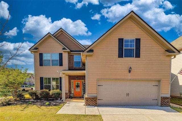43 Greencove Ct, Newnan, GA 30265 - view of front facade with brick siding, an attached garage, driveway, and a front lawn