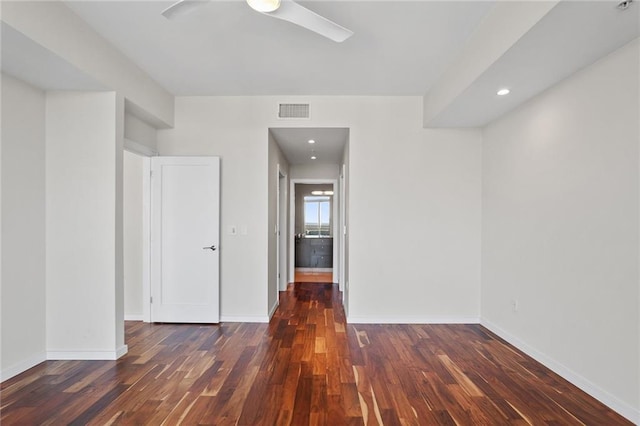 unfurnished room with ceiling fan and dark hardwood / wood-style floors