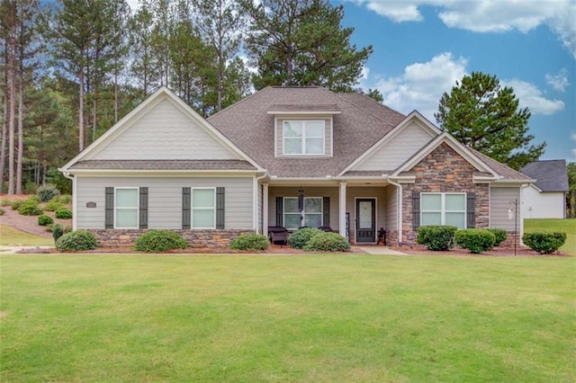 craftsman-style house with a front lawn