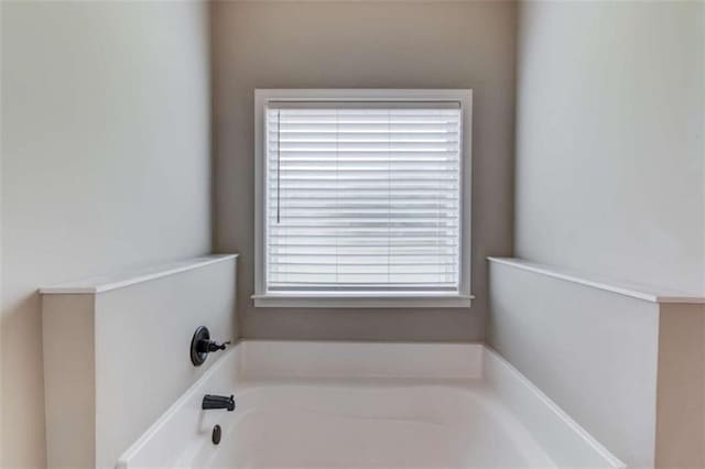 bathroom with a washtub