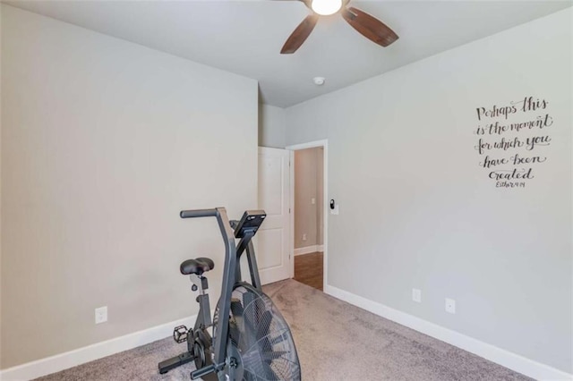 workout area featuring light carpet and ceiling fan