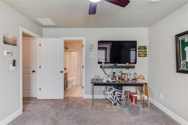 interior space with light carpet and ceiling fan